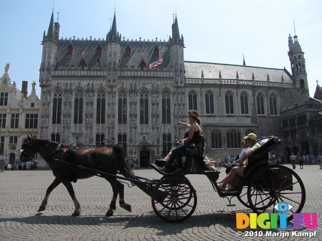 SX15560 Horse and carriage passing town hall in Brugge